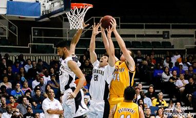 Basket Ball players shooting hoops