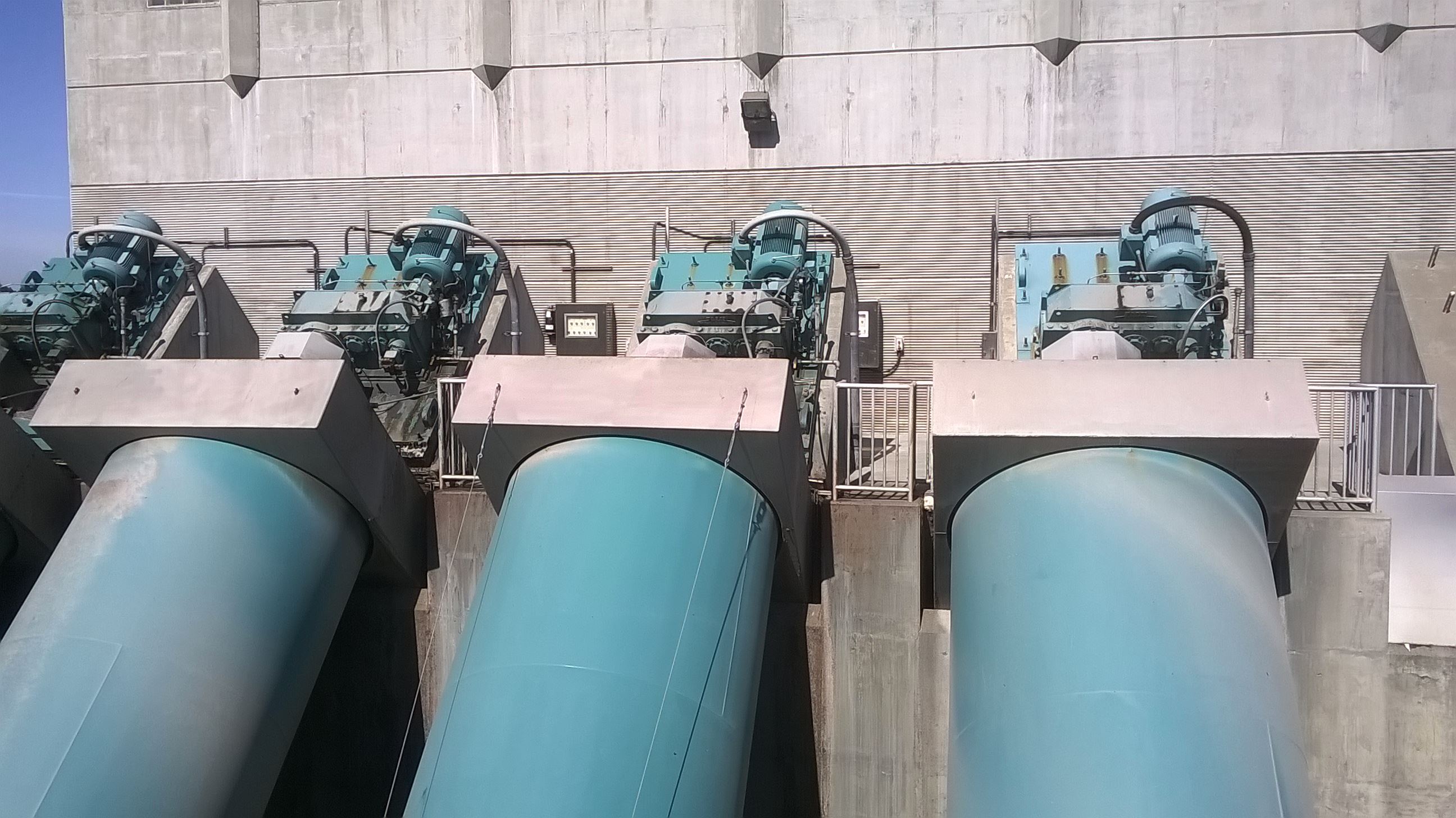 Four large screw pumps pull water into the treatment facility.